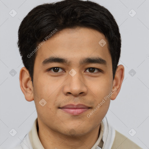 Joyful asian young-adult male with short  brown hair and brown eyes