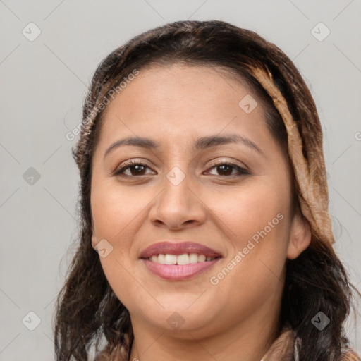 Joyful white young-adult female with long  brown hair and brown eyes