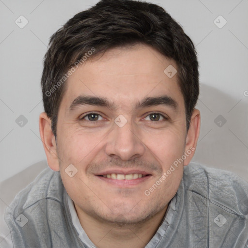 Joyful white young-adult male with short  black hair and brown eyes