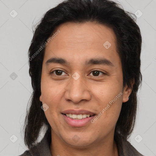 Joyful latino adult female with medium  brown hair and brown eyes