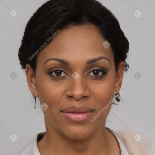 Joyful black young-adult female with short  brown hair and brown eyes