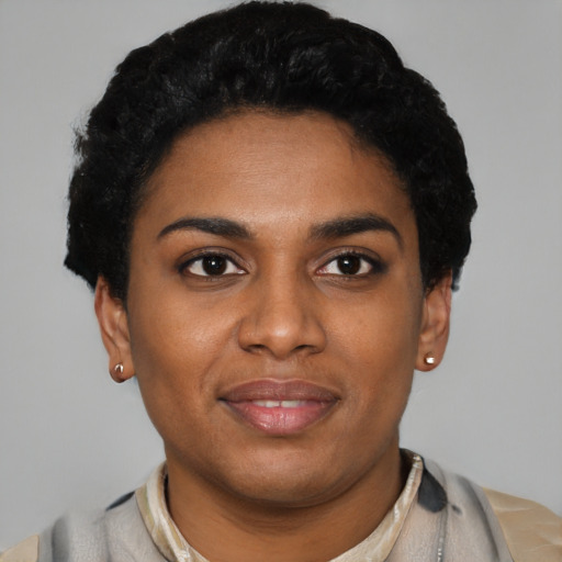 Joyful latino young-adult female with short  black hair and brown eyes
