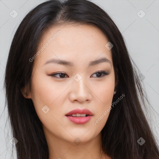 Joyful asian young-adult female with long  brown hair and brown eyes