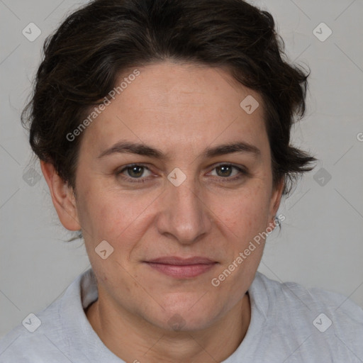 Joyful white adult female with short  brown hair and brown eyes