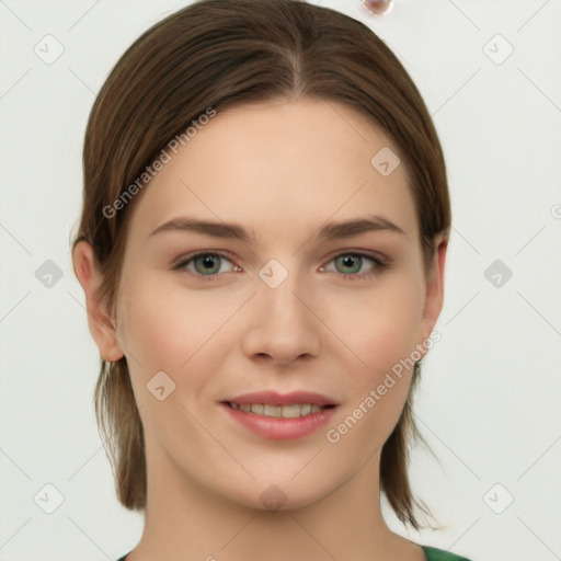 Joyful white young-adult female with medium  brown hair and grey eyes