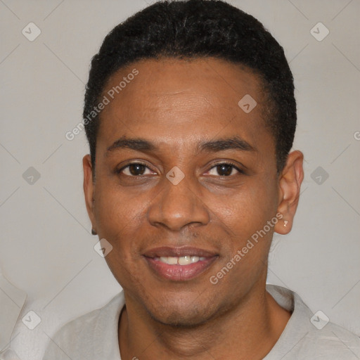 Joyful black young-adult male with short  black hair and brown eyes