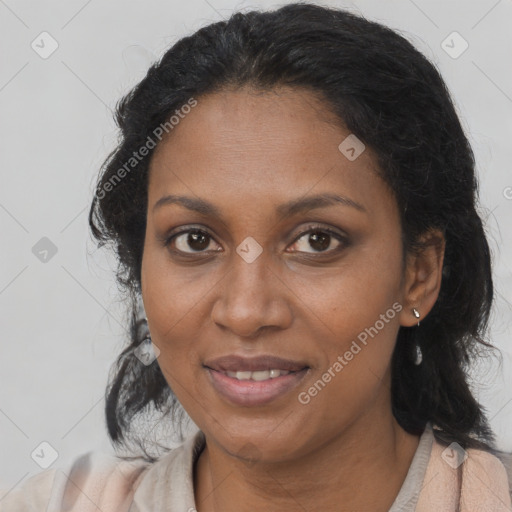 Joyful black adult female with medium  brown hair and brown eyes