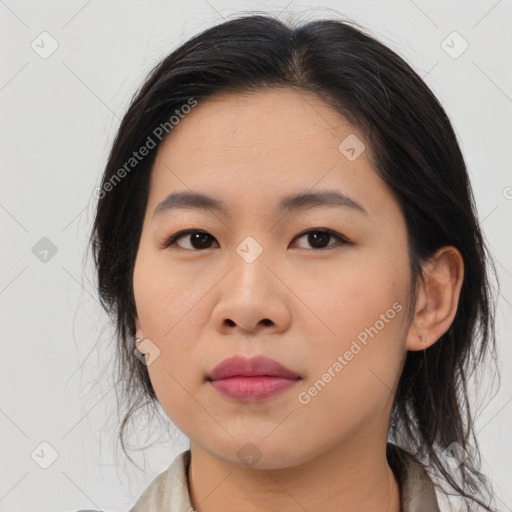 Joyful asian young-adult female with medium  brown hair and brown eyes