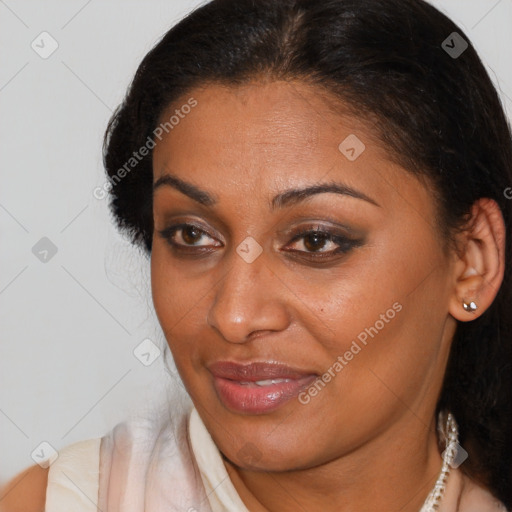 Joyful latino adult female with short  brown hair and brown eyes