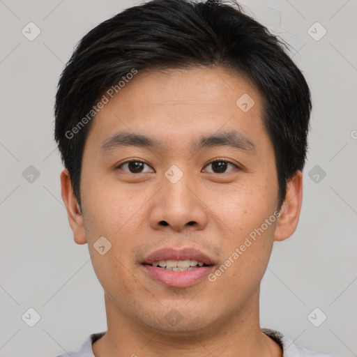 Joyful asian young-adult male with short  brown hair and brown eyes