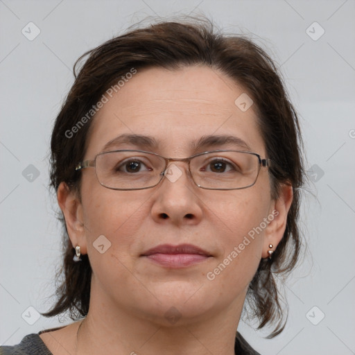 Joyful white adult female with medium  brown hair and brown eyes