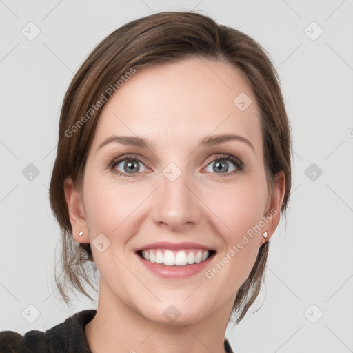 Joyful white young-adult female with medium  brown hair and grey eyes