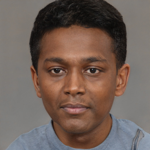 Neutral black young-adult male with short  black hair and brown eyes
