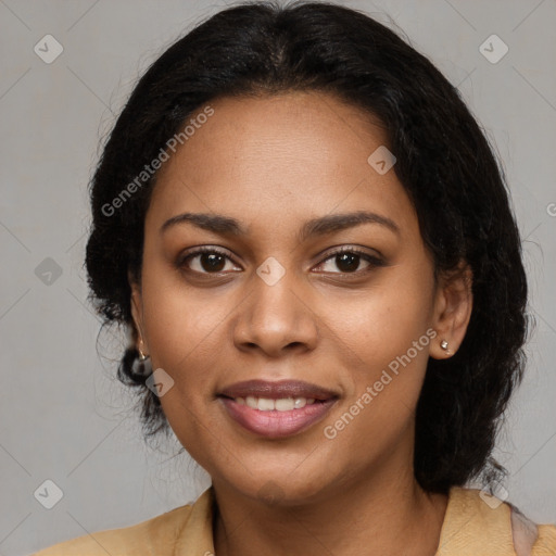 Joyful black young-adult female with long  brown hair and brown eyes