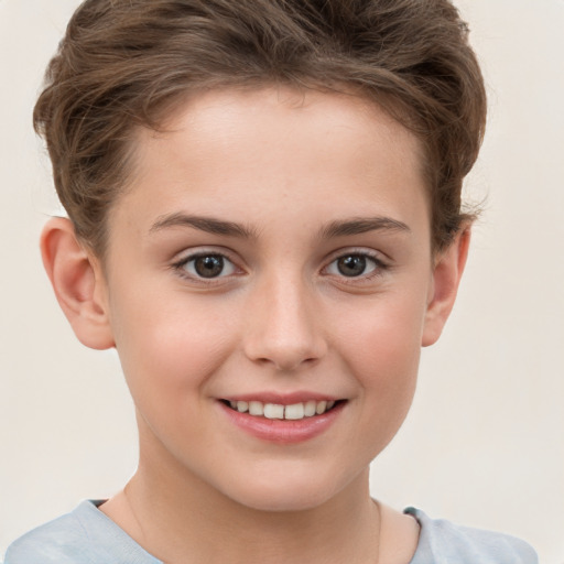 Joyful white child female with short  brown hair and brown eyes