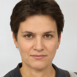 Joyful white adult female with short  brown hair and brown eyes