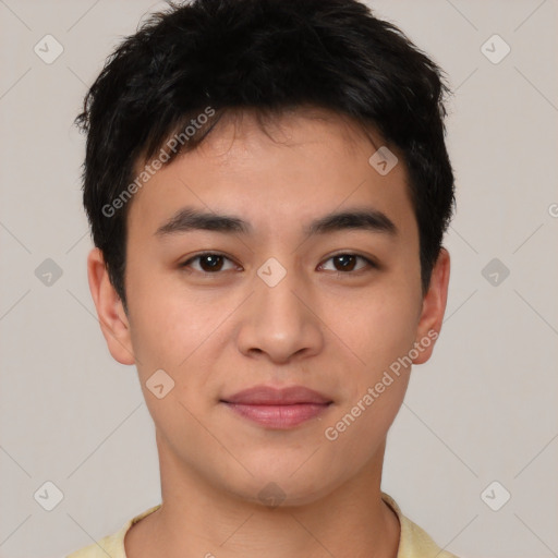 Joyful asian young-adult male with short  brown hair and brown eyes