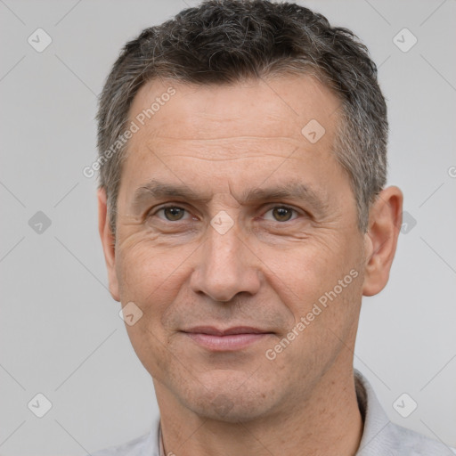 Joyful white adult male with short  brown hair and brown eyes