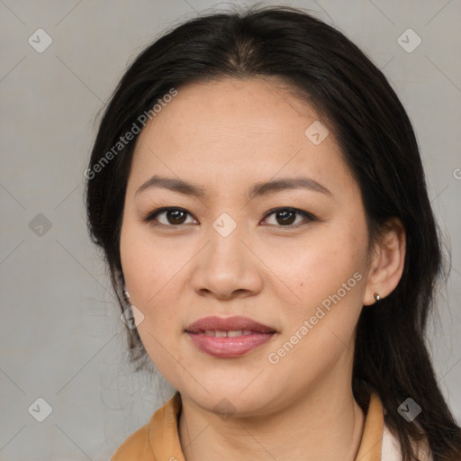 Joyful asian young-adult female with long  brown hair and brown eyes