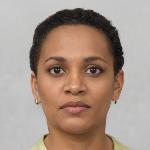 Neutral latino young-adult female with short  brown hair and brown eyes