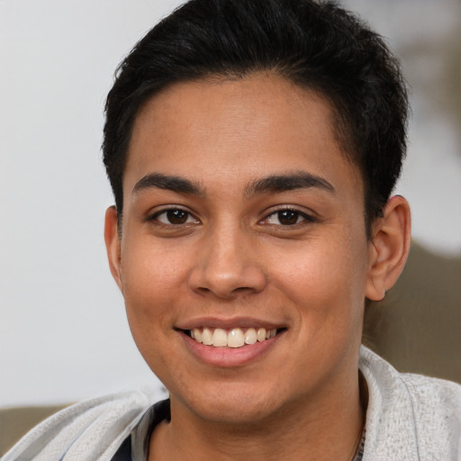 Joyful latino young-adult female with short  brown hair and brown eyes