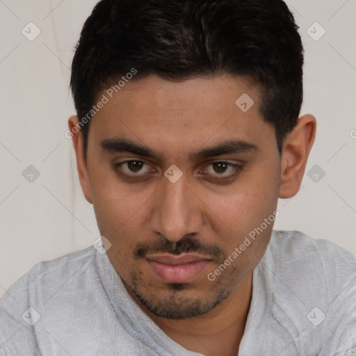 Joyful white young-adult male with short  black hair and brown eyes