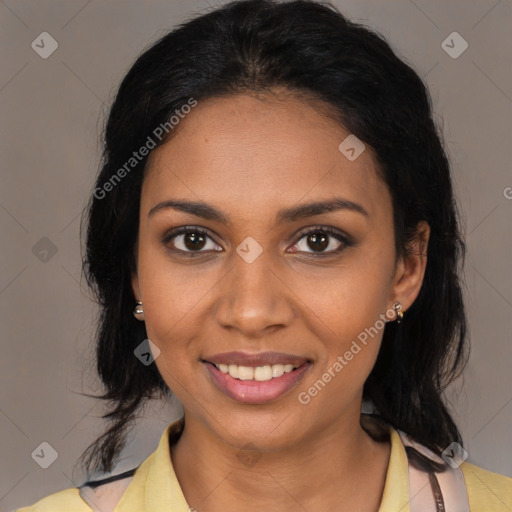 Joyful black young-adult female with medium  black hair and brown eyes