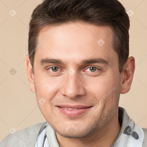 Joyful white young-adult male with short  brown hair and brown eyes