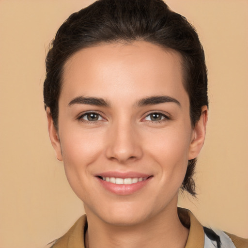 Joyful white young-adult female with medium  brown hair and brown eyes