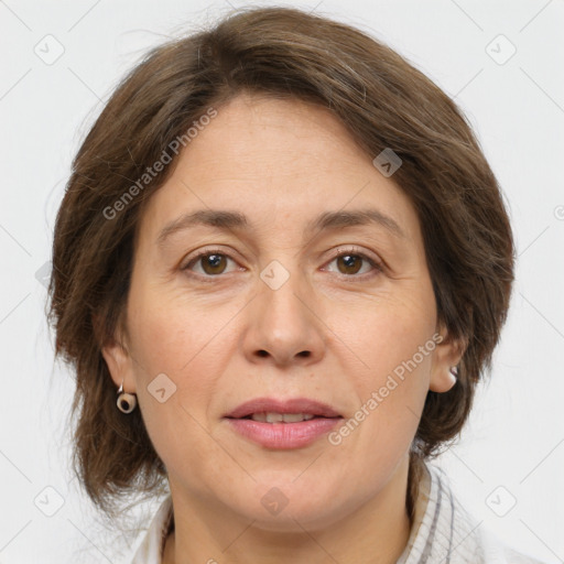 Joyful white adult female with medium  brown hair and grey eyes