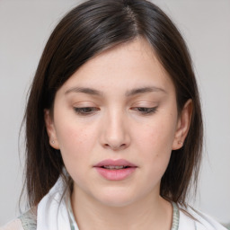 Neutral white young-adult female with medium  brown hair and brown eyes