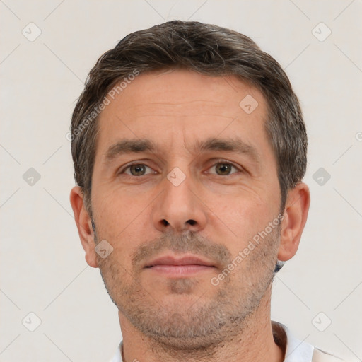 Neutral white adult male with short  brown hair and brown eyes