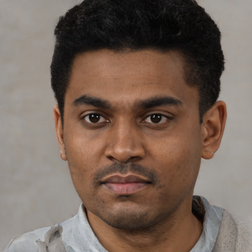Neutral latino young-adult male with short  black hair and brown eyes