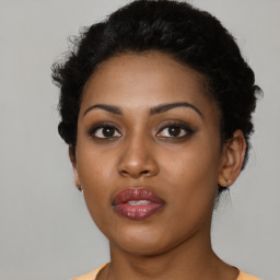 Neutral black young-adult female with short  black hair and brown eyes