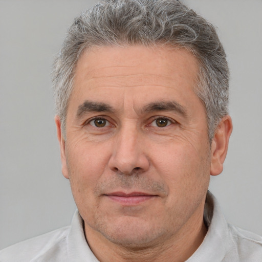 Neutral white middle-aged male with short  gray hair and brown eyes