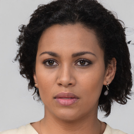 Neutral latino young-adult female with short  brown hair and brown eyes