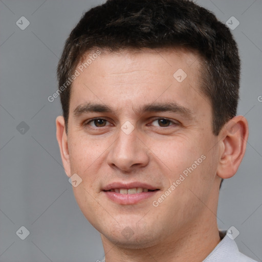 Joyful white young-adult male with short  brown hair and brown eyes