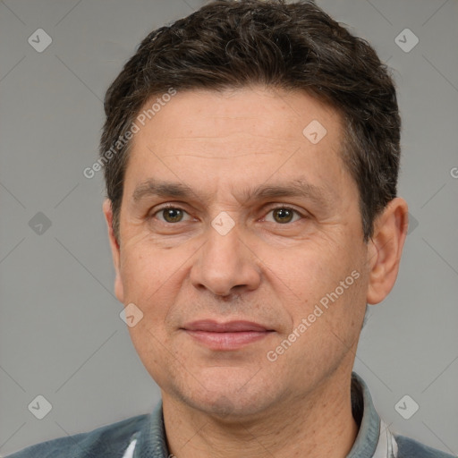 Joyful white adult male with short  brown hair and brown eyes