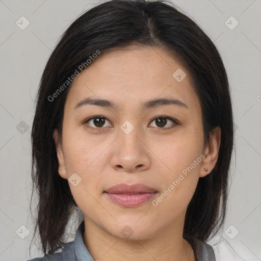 Joyful asian young-adult female with medium  brown hair and brown eyes