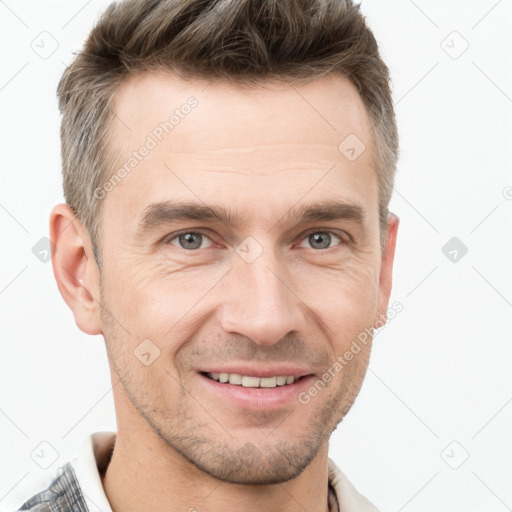 Joyful white adult male with short  brown hair and grey eyes