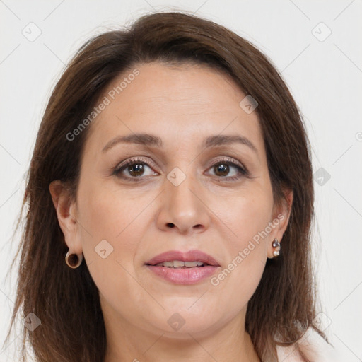 Joyful white adult female with long  brown hair and brown eyes