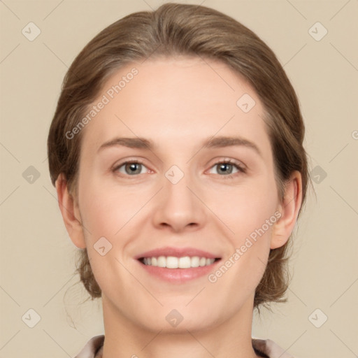 Joyful white young-adult female with medium  brown hair and green eyes