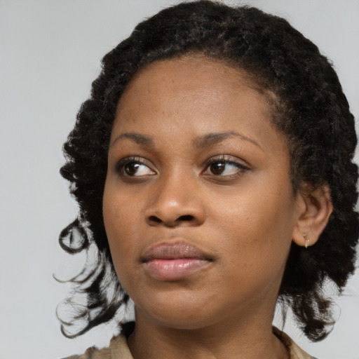 Neutral black young-adult female with medium  black hair and brown eyes