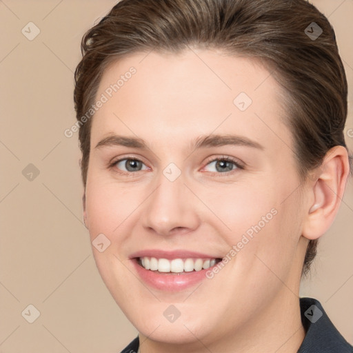 Joyful white young-adult female with medium  brown hair and grey eyes