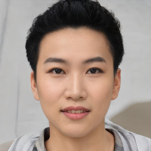 Joyful asian young-adult female with short  black hair and brown eyes