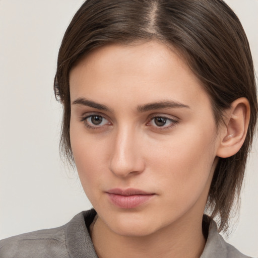 Neutral white young-adult female with medium  brown hair and brown eyes