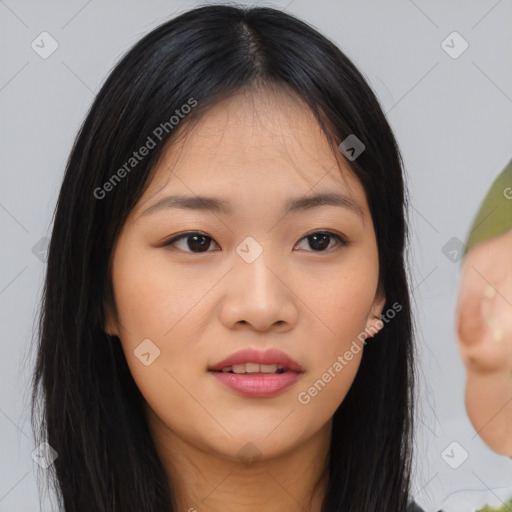 Joyful asian young-adult female with long  black hair and brown eyes