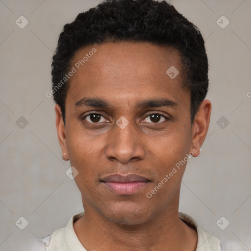 Joyful black young-adult male with short  black hair and brown eyes