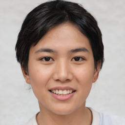 Joyful asian young-adult female with short  black hair and brown eyes