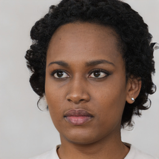 Neutral black young-adult female with short  black hair and brown eyes